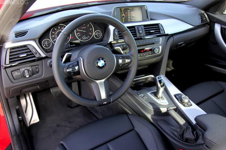 Interior of 2014 BMW 328d showing dashboard and seats