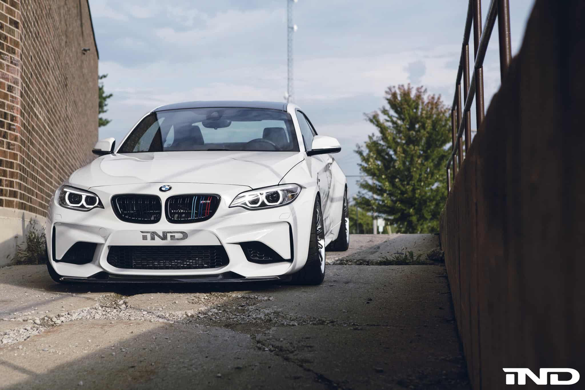 A Slammed Alpine White BMW M2 With Carbon Fiber Goodies By IND Distribution