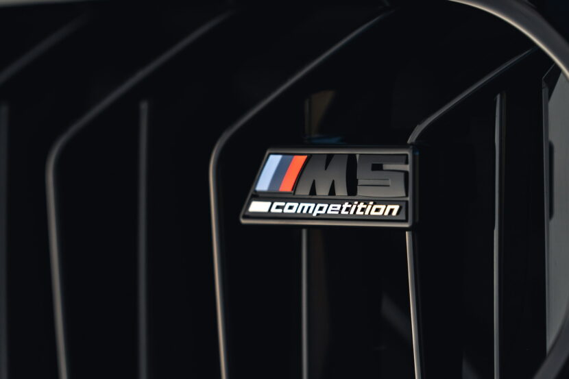 BMW M5 with a peculiarly wide rear axle spotted out testing