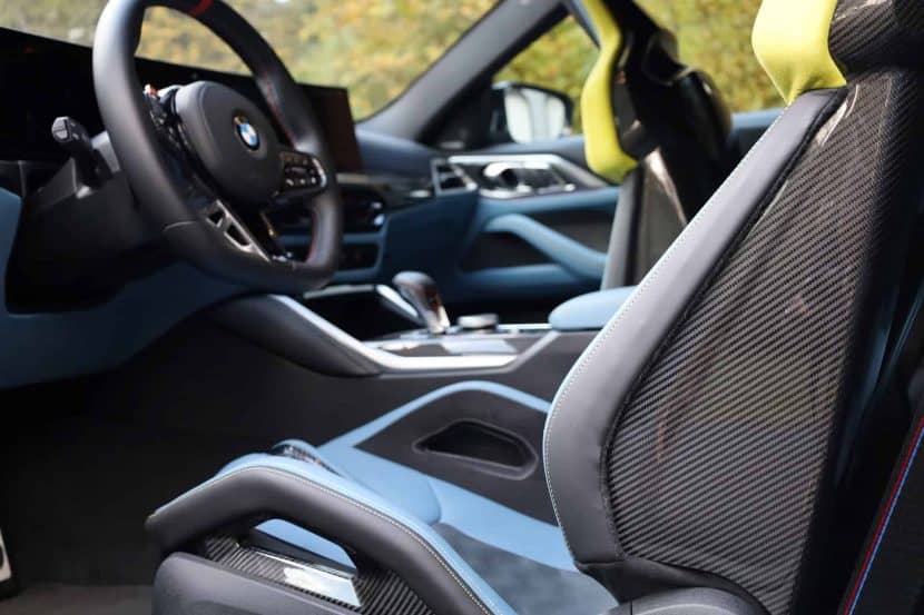 2025 BMW M4 Competition interior with carbon bucket seats and digital cluster