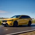 2025 BMW M5 Touring Speed Yellow front three-quarter view