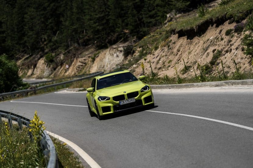 2025 BMW M2 in Sao Paulo Yellow parked on a mountain road