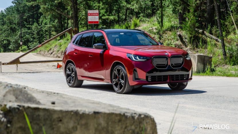 2025 BMW X3 M50 in Vegas Red Metallic front three-quarter view during road test