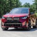 2025 BMW X3 M50 in Vegas Red Metallic front three-quarter view during road test