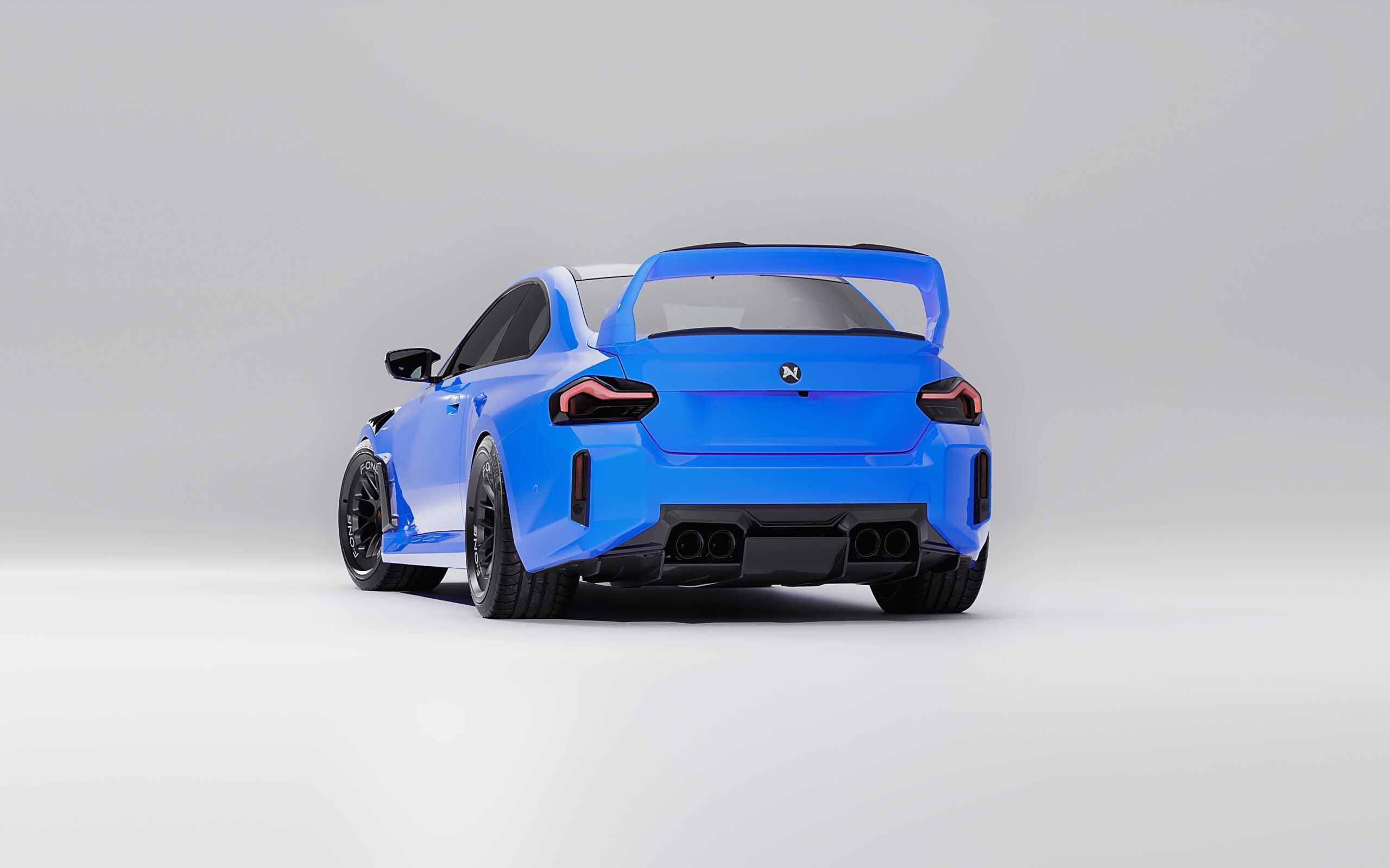 Sporty blue BMW M2 car with aerodynamic features and racing tires