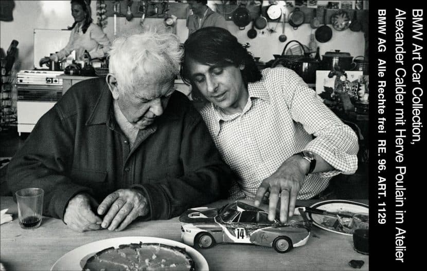 ARTIST ALEXANDER CALDER BMW AND HERVE POULAIN working on a miniature car 