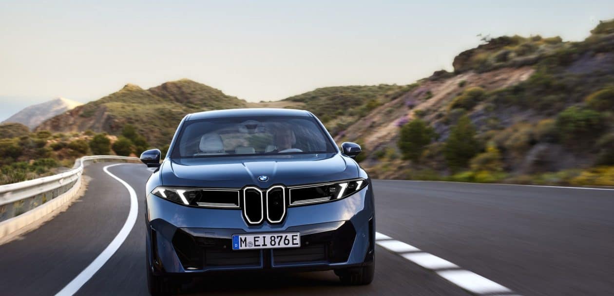 2026 BMW IX3 driving on the road