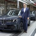 BMW Board Member Dr. Milan Nedeljkovic and a BMW iX3 production vehicle on assembly line in Debrecen