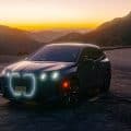 2026 BMW IX M70 with glowing headlights