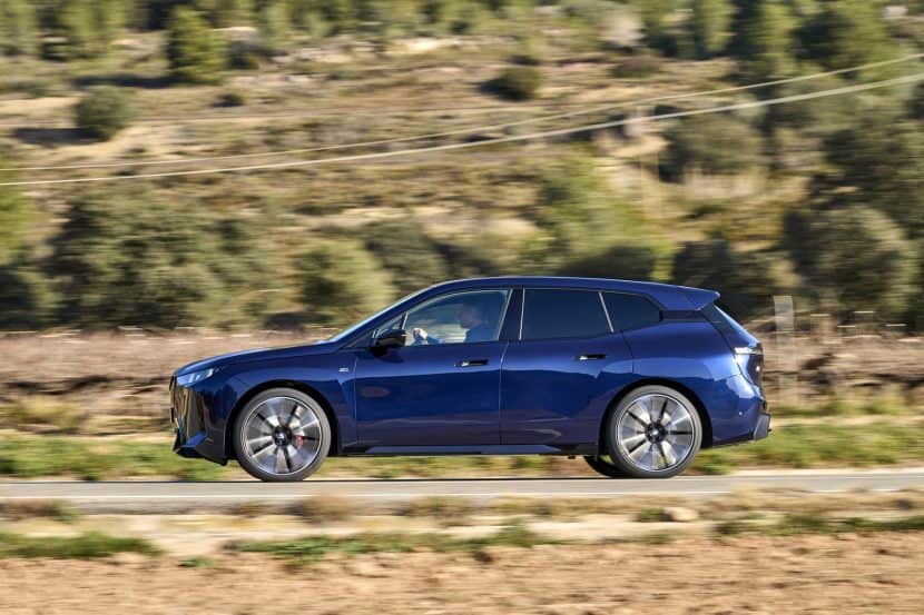 2026 BMW IX M70 TEST DRIVE REVIEW side view on the road