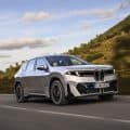 BMW IX3 SPACE SILVER on the road driving