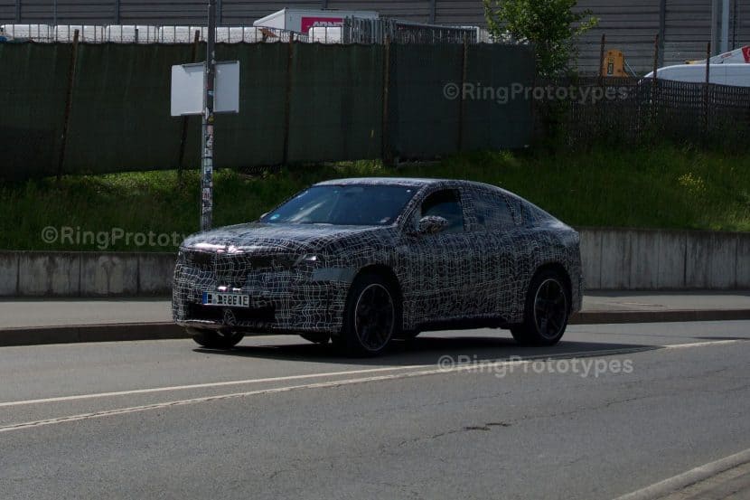BMW's New Electric Coupe-SUV Just Showed Its Shape Near the Ring