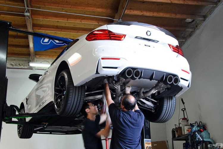 Remus Exhaust System Installed On Alpine White BMW M4