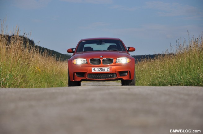 BMW 1M in Valencia Orange on back roads
